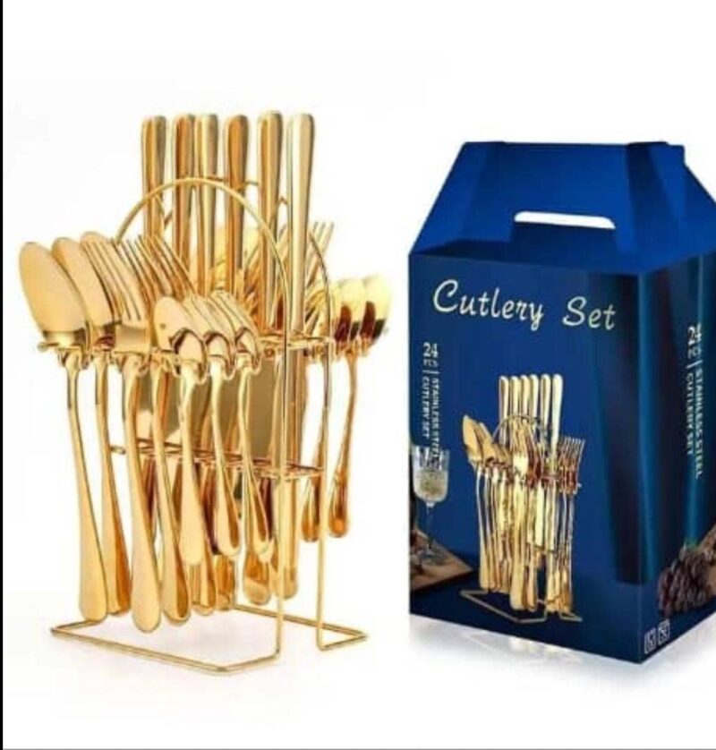 Gold spoons placed on a dining table as part of a modern dinnerware set for everyday use